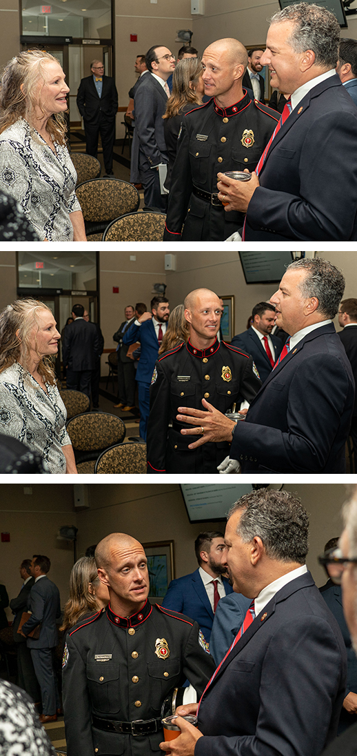 Patronis speaking with people at meeting