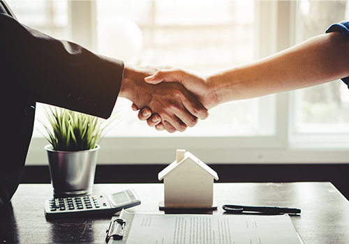AOB-Thumbnail shaking hands over desk