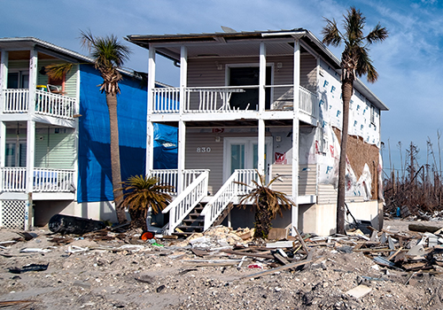 two homes ravaged by hurricane damage