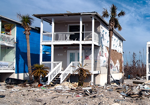 Hurricane-Deductible-Thumb two-story home damaged by hurricane