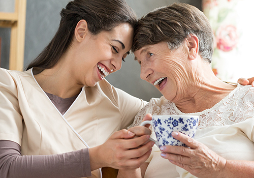 happy healthcare worker with senior