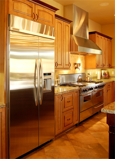 Equipment Breakdown Coverage Kitchen scene with stainless refrigerator and stove