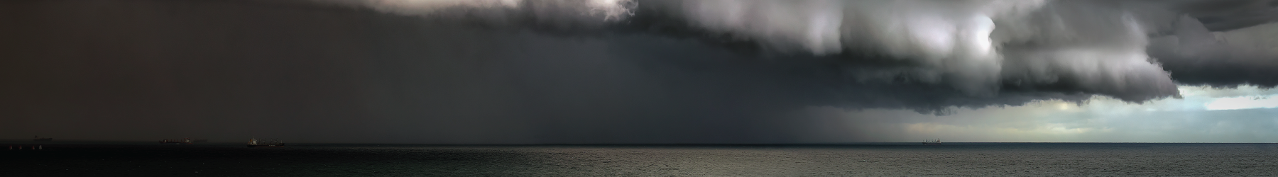 Storm with very dark clouds moving in over the ocean