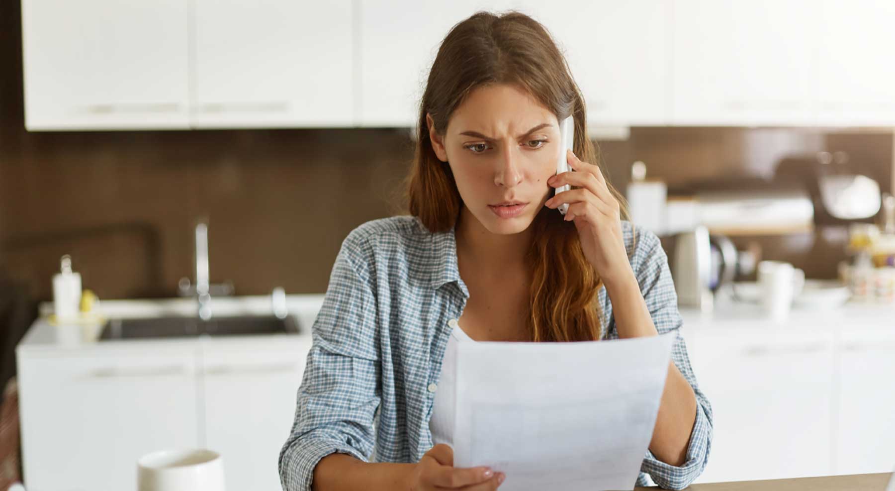 Policy Cancellation Policy Cancellation Scam Example- Worried lady on phone
