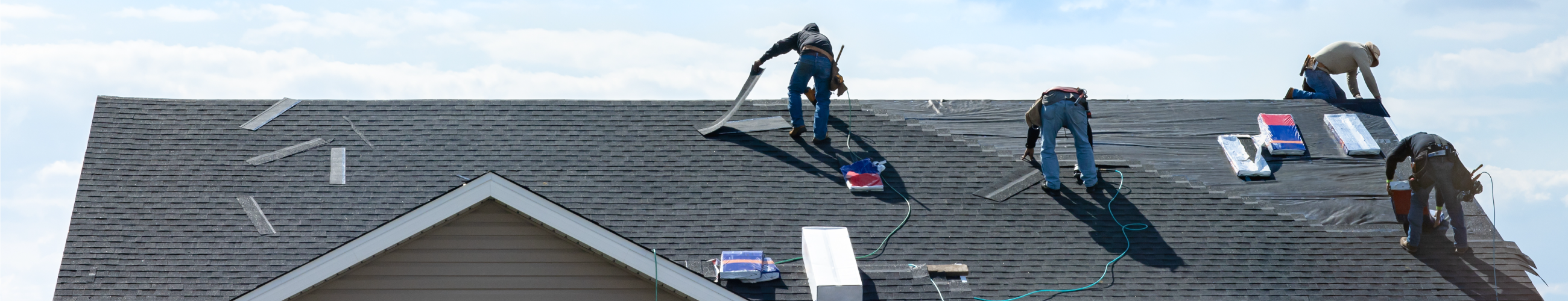Property Insurance Header Men working on roof