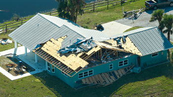 Hurricane Damaged House House with roof damage from Hurricane Ian
