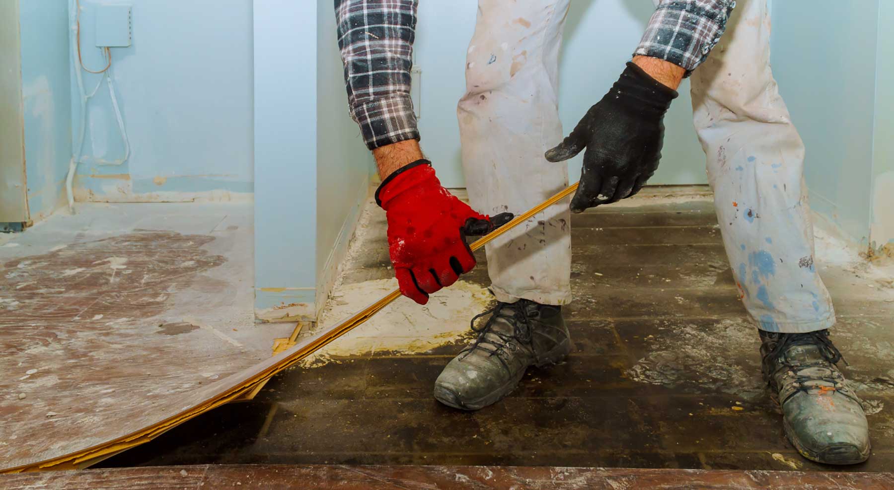 Unlicensed contractor Man pulling up floors