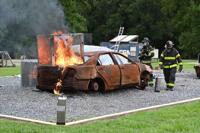 A demonstration of a lithium ion battery being set on fire given by two firefighters