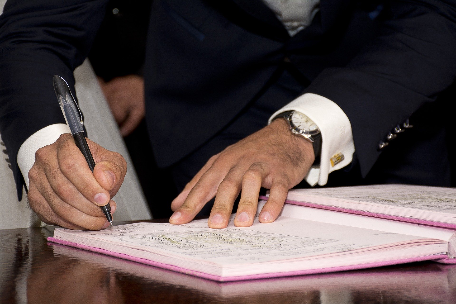 Trust Fund Management man signing documents